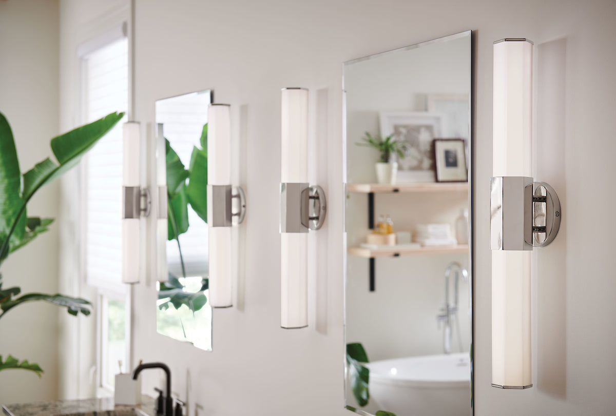Bathroom vanity lighting Facet by Hinkley, sconces on each side of bathroom mirror.