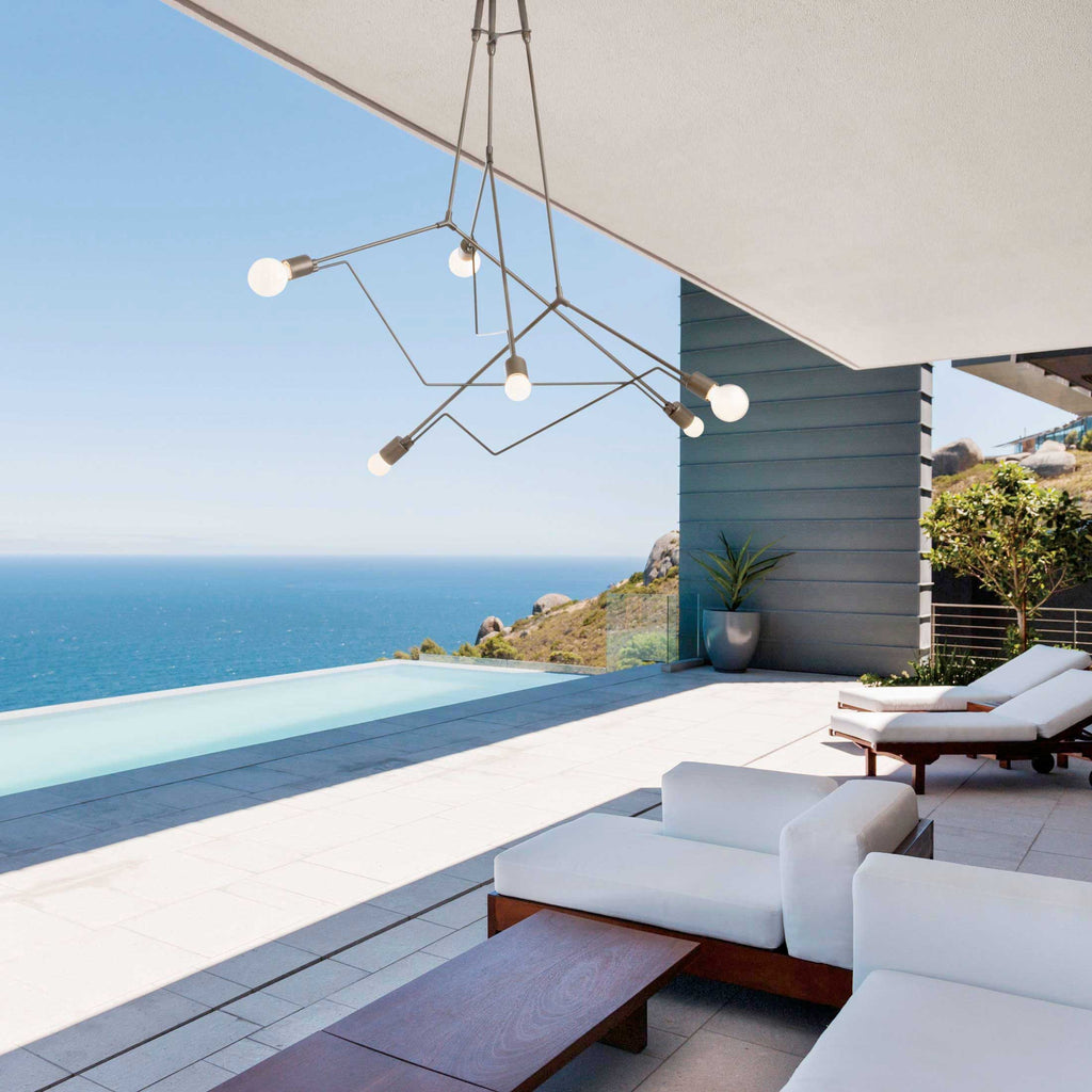 beautiful scenic view of the pacific ocean from the deck of a waterfront home with the hubbardton forge divergence outdoor light fixture in view